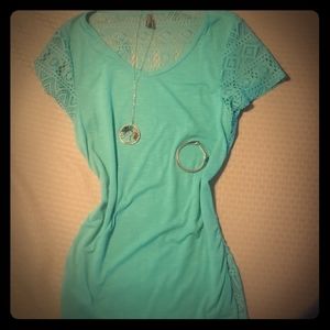 Teal colored lace back top